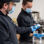 CBD and Coronavirus: Despite Crisis, Industry Still Delivering Good Vibes Brendan-McDermott-and-Alex-Althaus-looking-over-production-line-Nu-X-coronavirus-CBD-CBDToday