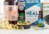 Joliet, Illinois / USA - December 9, 2018: Medicinal hemp CBD oil packages, capsules and tinctures displayed on a white background